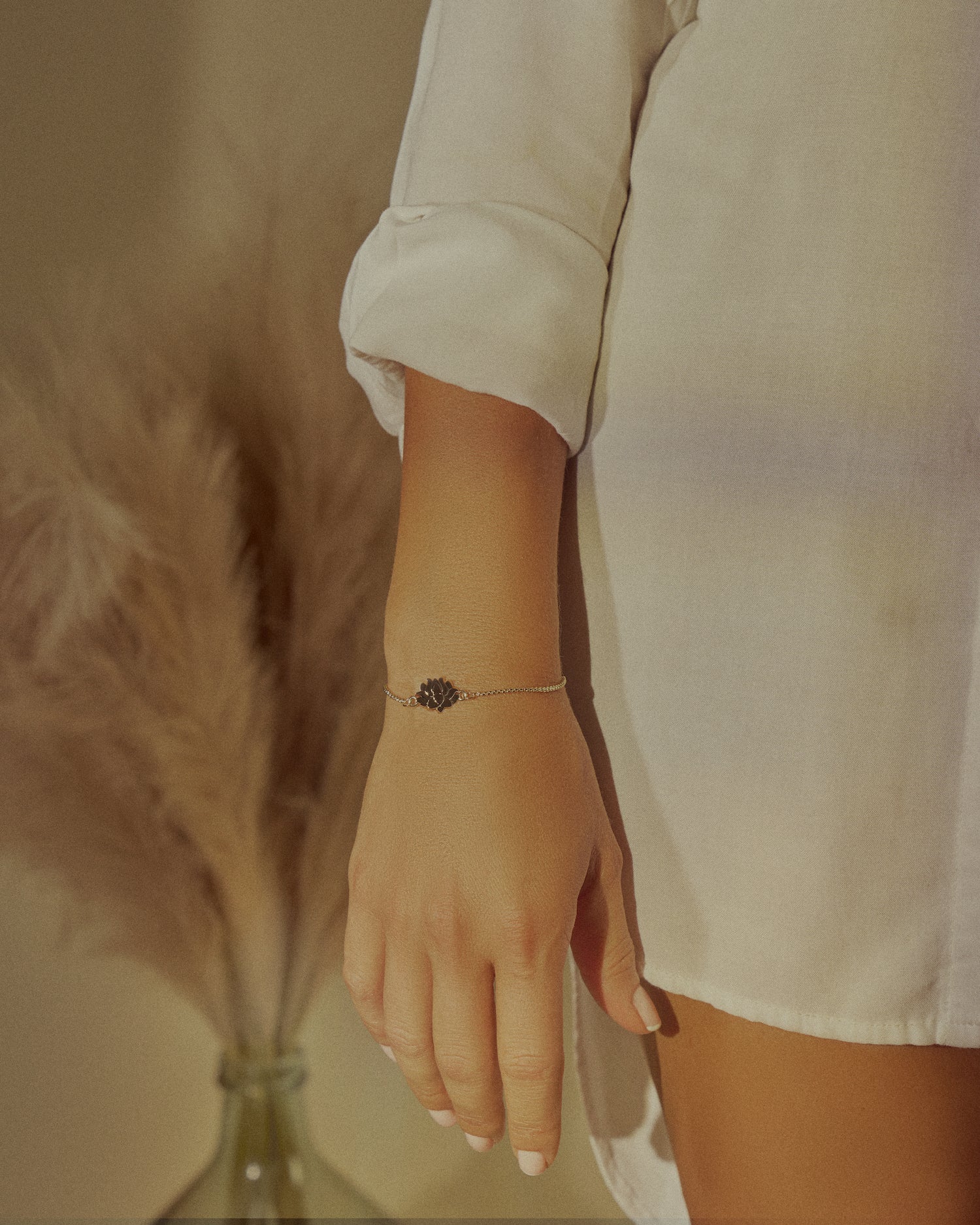 girl wearing gold lotus flower bracelets