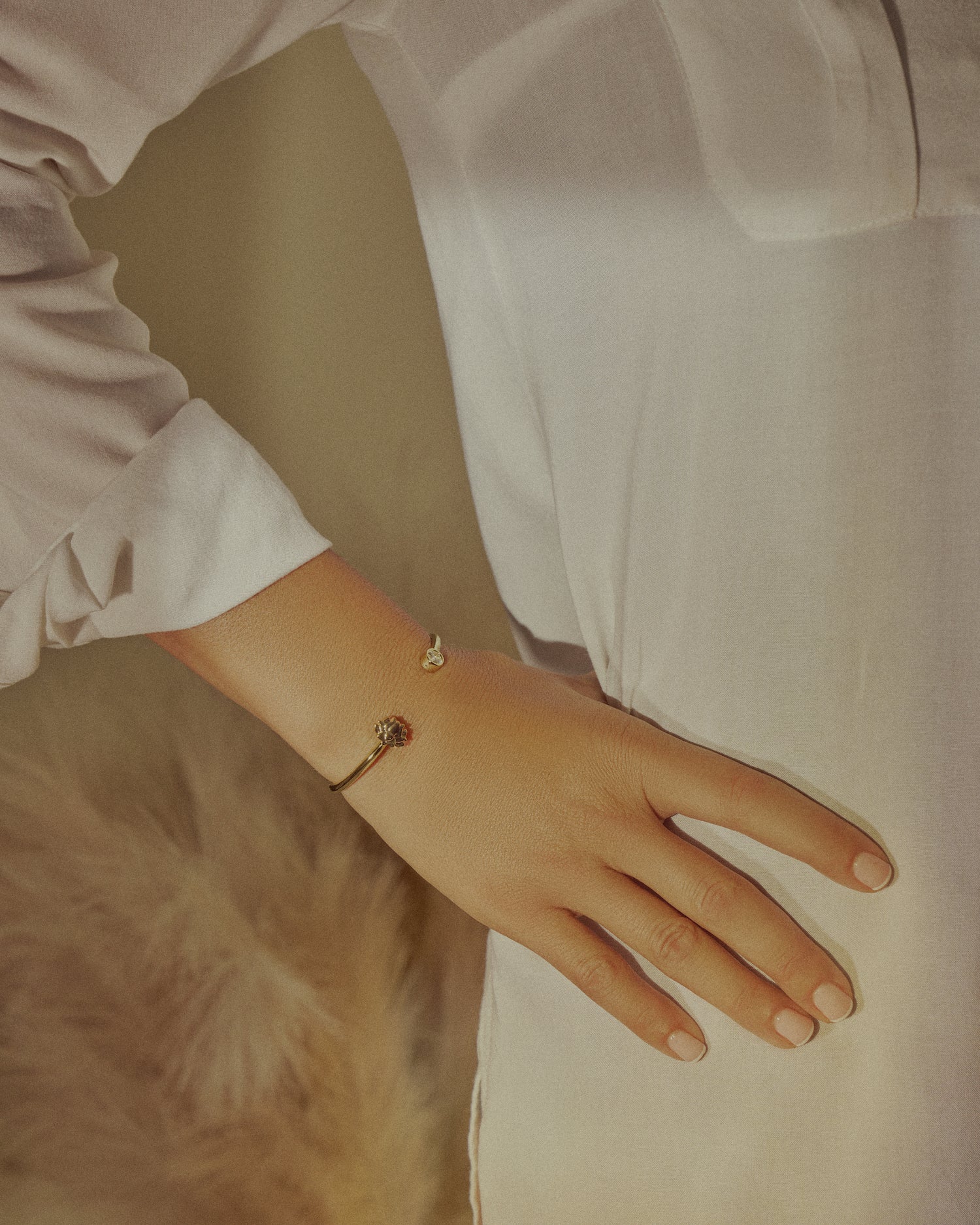 girl wearing gold cuff bracelets