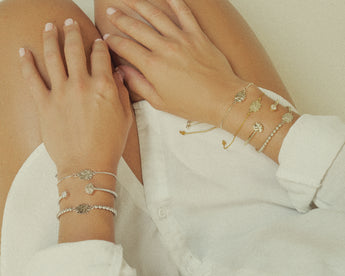 girl wearing silver lotus flower bracelets